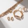 Set 4 objects: earrings, necklaces, bracelet, “evening” ring volume, yellow in gold