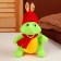 Soft toy "Dragon", in a red hat with ears, 15 cm, green color