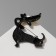 Cartoon brooch "Dog" of a dachshund, colored in ferrous metal