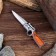 A folding semi -automatic "gun", a blade 7 cm, with a flashlight