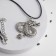 Piece on the cord "Snake", color black silver on a black lace, 42 cm
