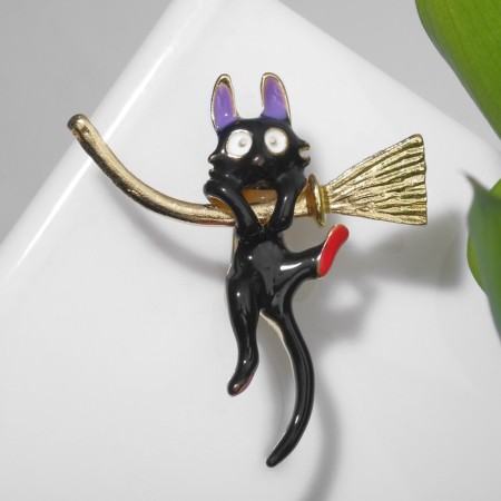 Brooch "Cat" on a broomstick, color in gold