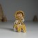 Souvenir Polystone "Baby in a white fur coat, with a heart" sits 5x5x8 cm