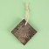 Natural pedicure pumice, with a suspension, 8 × 8 cm, in a box, brown color