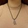 Unisex “Hand” pendant, color black silver on a black lace, 40 cm