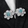 Cardigan clamp "Flower", blue color in silver