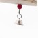 A toy with a karakatitsa carapace, lufoi and bell, 20 x 5 cm, orange