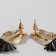 Earrings Metal "Trend" oval and triangle, black color in glossy gold