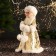 Snow Maiden "In a clutch with fur bombs" 33 cm, golden-white