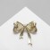 Board "Cat's Eye" bow, white color in gold