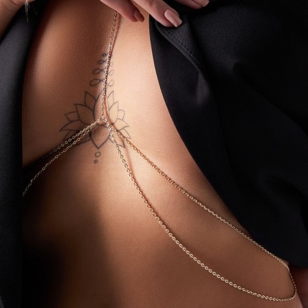 Erotic accessory on the chest, golden