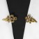 Cardigan clamp "Bant", the color of gold in black gold