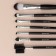 A set of makeup brushes, 7 items, a cover on a button, black color
