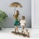 Polystone souvenir "Children walk under an umbrella, with a puppy" Bronze 18x9.5x21.5 cm