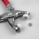 Forceps for installing buttons, with rubberized handles, with buttons 25 pcs, 15 × 6.5 cm, silver/red color