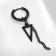 Piercing in the ear "Ring" Triangle with a chain, d = 15 mm, black color
