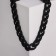 The necklace "chain" is flat links, black color, 48cm