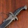 Curved souvenir knife, 26.5 cm, a long curl on the scabbard, black