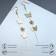 Hanging earrings "Butterflies and flowers", white color in gold, 10 cm
