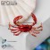Brooch "Crab", red color in gold