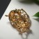 Brooch "Flilly Flood" on a branch, white color in gold