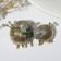 Brooch "Sheep" steam, gray color in black gold