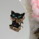 Brooch "cat" is cunning, the color is black and green in gold
