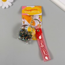 A plastic keychain with a carbine, a strap of 