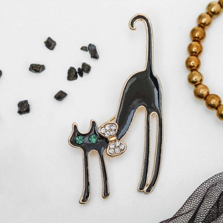 Brooch "Graceful cat with a bow", the color is black in gold-2
