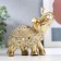 Souvenir Polystone "Golden Elephant with a blade of beads with bells" mix 11.5x11x5.5 cm
