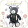 Soft toy "Little Friend", New Year's bear with a green scarf, dark gray color