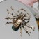 Brooch "Spider", color brown-green in black pink gold