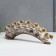 Polystone souvenir "Seven white elephants with a blanket from the Arab carpet on a horn" 11.5x31x5 cm