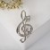 Brooch "Violin key" and notes, white color in silver