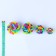 Rubber toy "molecule" with a bell, 4 cm, mix of flowers