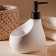 A soap dispenser with a Savanna drop sponge stand, 450 ml, white color