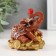 Polystone souvenir "Elephant with ruby ​​on coins" 8x6.5x8.5 cm