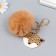 Fluffy on a ring with a carbine, metal "Leopard" Beige 12x6.5 cm