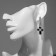 Earrings with rhinestones “crosses” chain, white-black color in silver