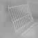 Inclined shelf on a grid, 70 degrees, 600 × 343 mm, white color