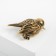 Brooch "Bird" Voruski, green color in black gold