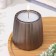 A candle in a candlelight made of gypsum with smooth faces, 9.5x9cm, gray-brown