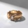 The ring "melting" is stuffed, the color is white in gold, dimensionless