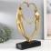 Polystone souvenir "Lovers in the plexus of the heart" gold 37x25x7 cm