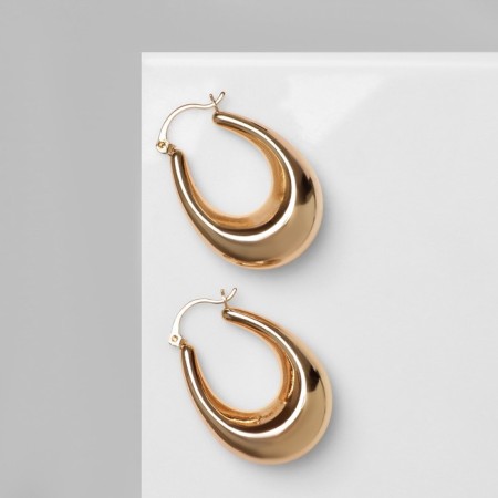 Earrings Metal are “wide” volumetric, color gold-1