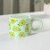 Ceramic mug with silicone lid of the Avocado shares, 350 ml, green color