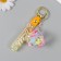 A plastic keychain with a carbine, a strap "Flying Base of a star" Water with decor1.8x5.3x5.6 cm