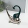 Souvenir ceramics "Elephant with an elephant. Heart" dark green with silver 7.3x17.5x22 cm