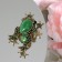 Brooch "Frog" cabochon, green color in gold