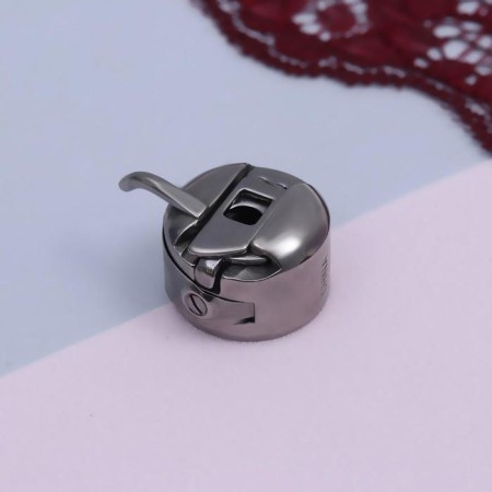 Bobbin cap to BSHM, right, 3 × 2.5 × 1.5 cm-1